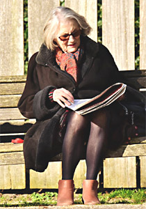 mother reading a newspaper